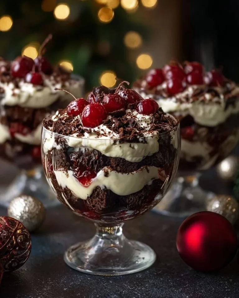 Delicious Black Forest Trifle dessert layered with chocolate, cherries, and whipped cream.