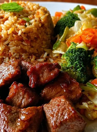 Delicious beef stir-fry plate served with veggies and fried rice