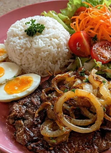 Garlic butter steak served with rice and fresh crunch salad on a plate