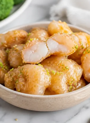Buffet style creamy coconut shrimp dish served on a platter
